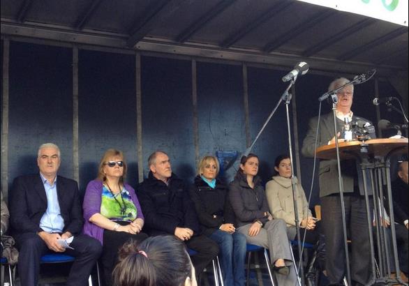 Ben Gilroy on platform with the Quinn family, Mickey Harte and others at Cavan protest last year