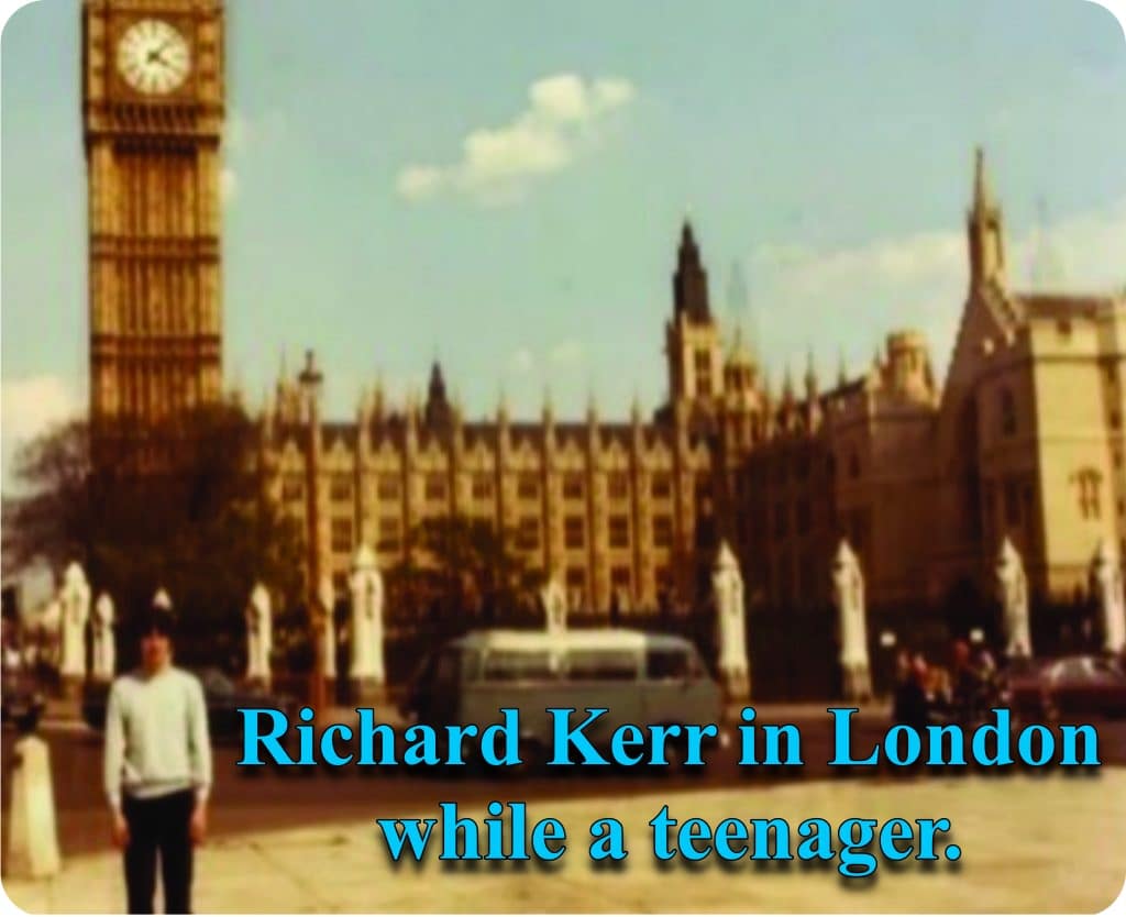 This image has an empty alt attribute; its file name is Kerr-outside-Westminster-with-blue-text.jpg