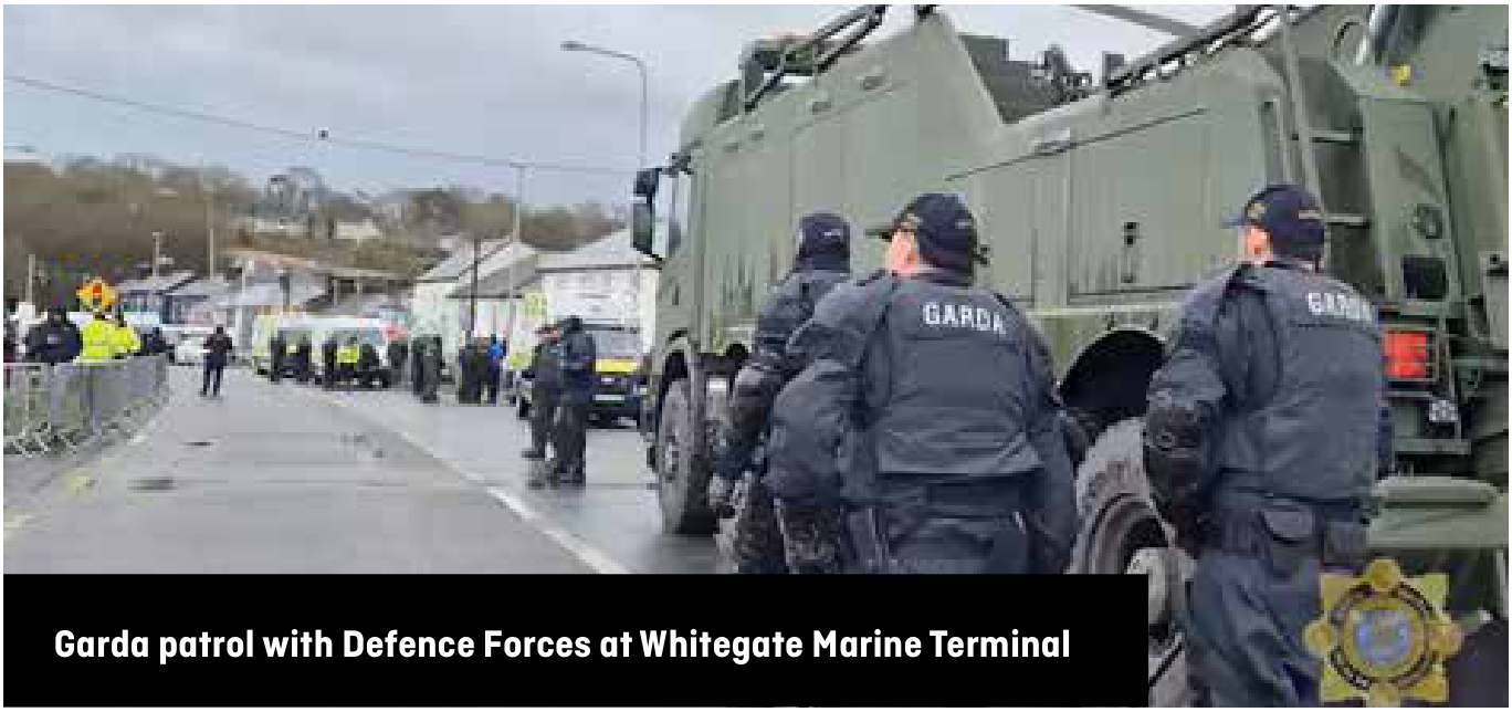 Garda officers and a Defence Forces vehicle at Whitegate Marine Terminal